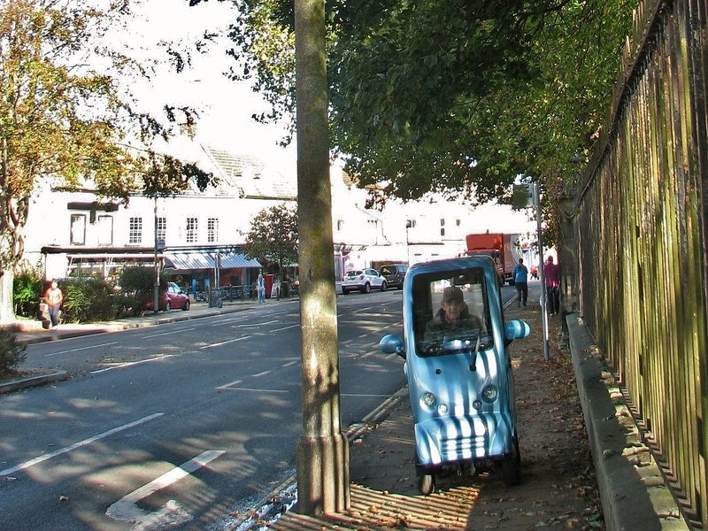 A mobility scooter on a pavement