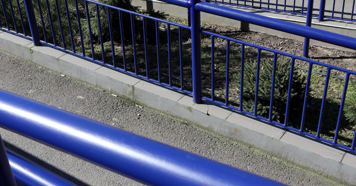 Wheelchair Ramp Costs UK Paved wheelchair access ramp with metal handrail