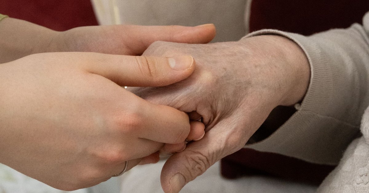 Hands being supported A close view of one pair of hands supporting another