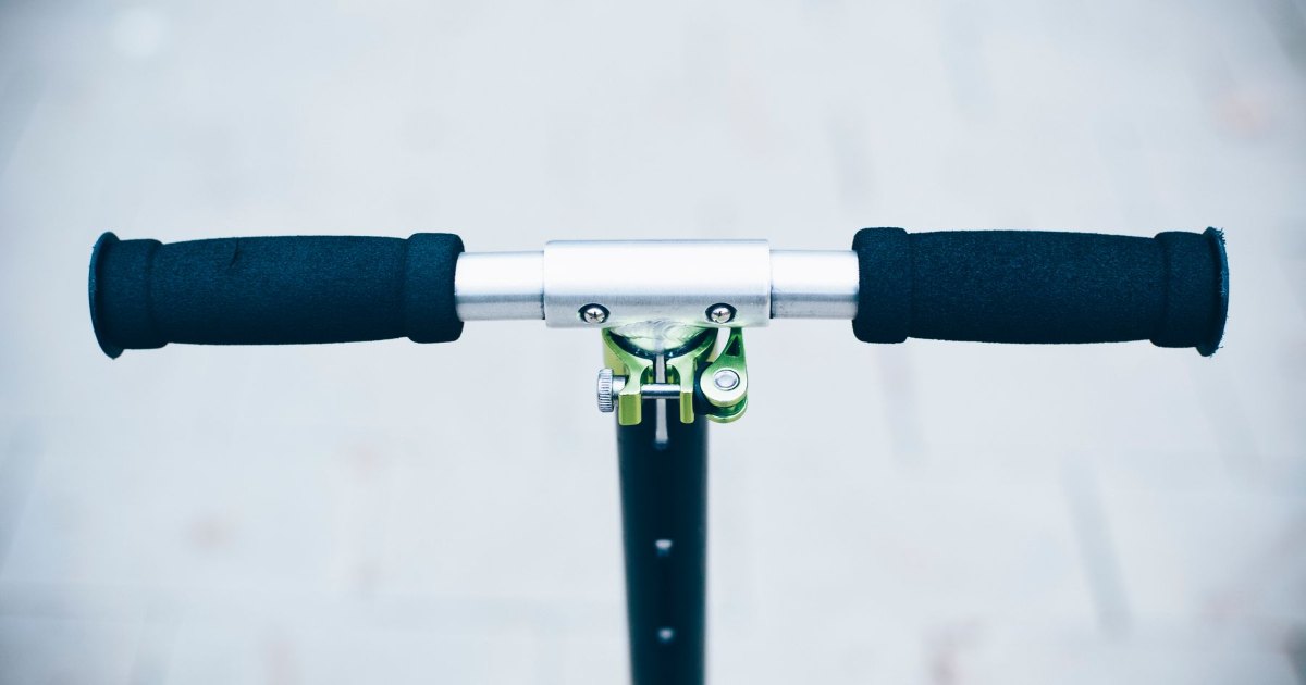 Scooter handlebars A close view of the handlebar grips and controls of a scooter