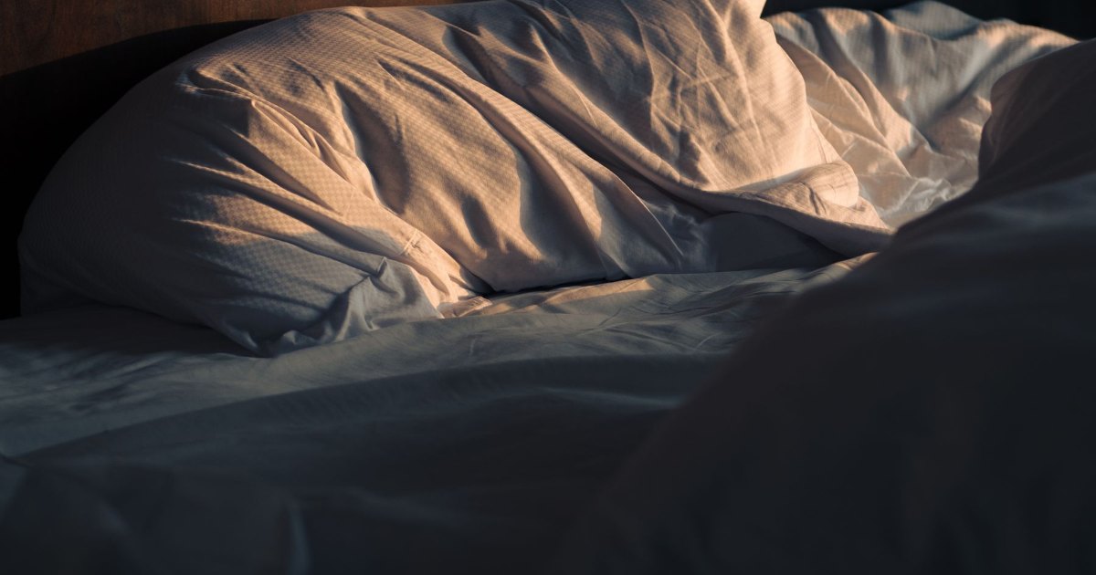 Bedding in morning light Bedding catching low morning light across a bed