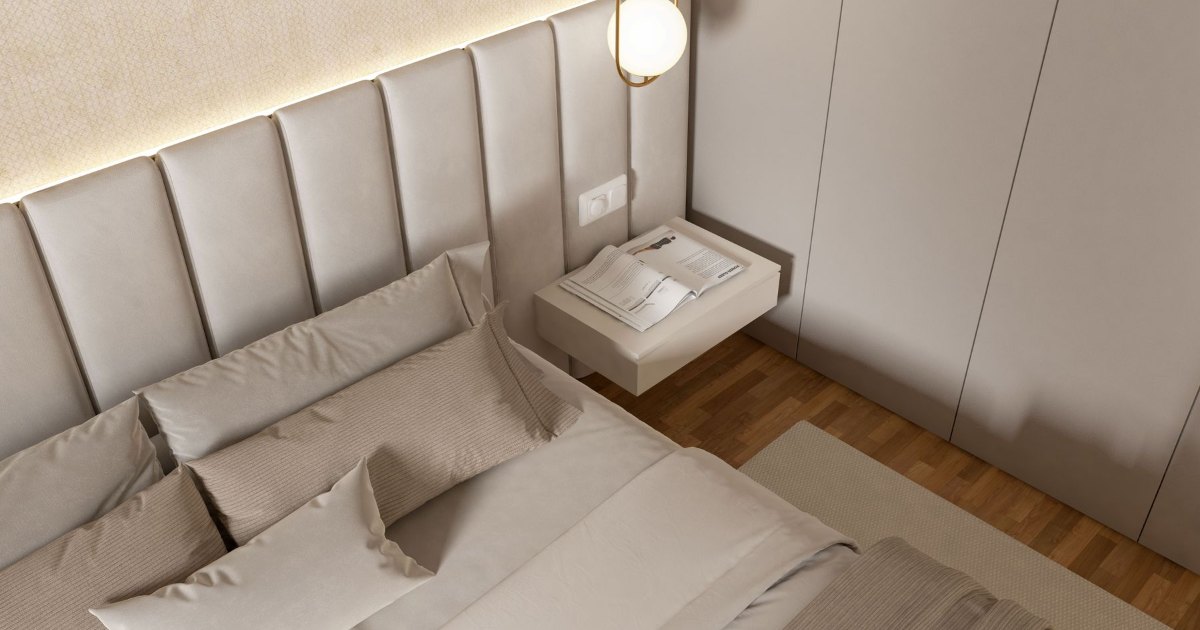 Bed in a bright bedroom A made bed in a bright, neutral bedroom