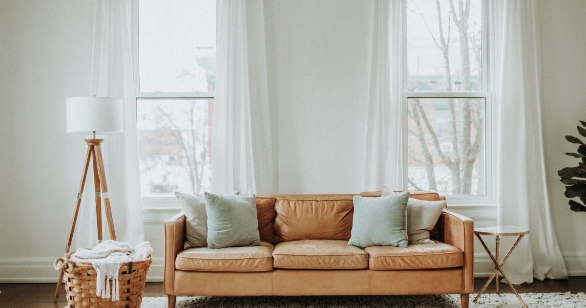 Sofa in a neutral living room A sofa and side table in a neutrally decorated living room