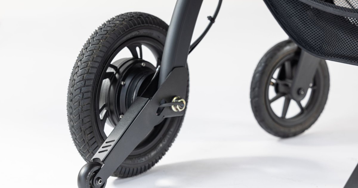 Folding wheelchair wheels and frame Close view of the wheels and frame of a lightweight folding wheelchair against a white background
