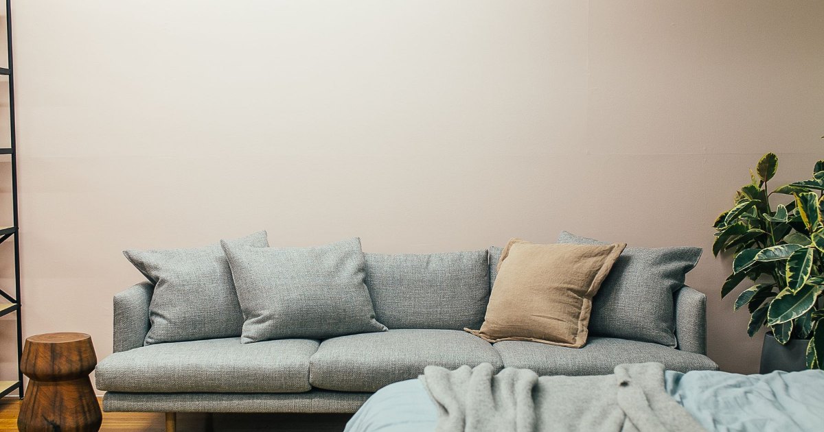 Grey sofa and cushions A grey sofa with cushions in a modern living room