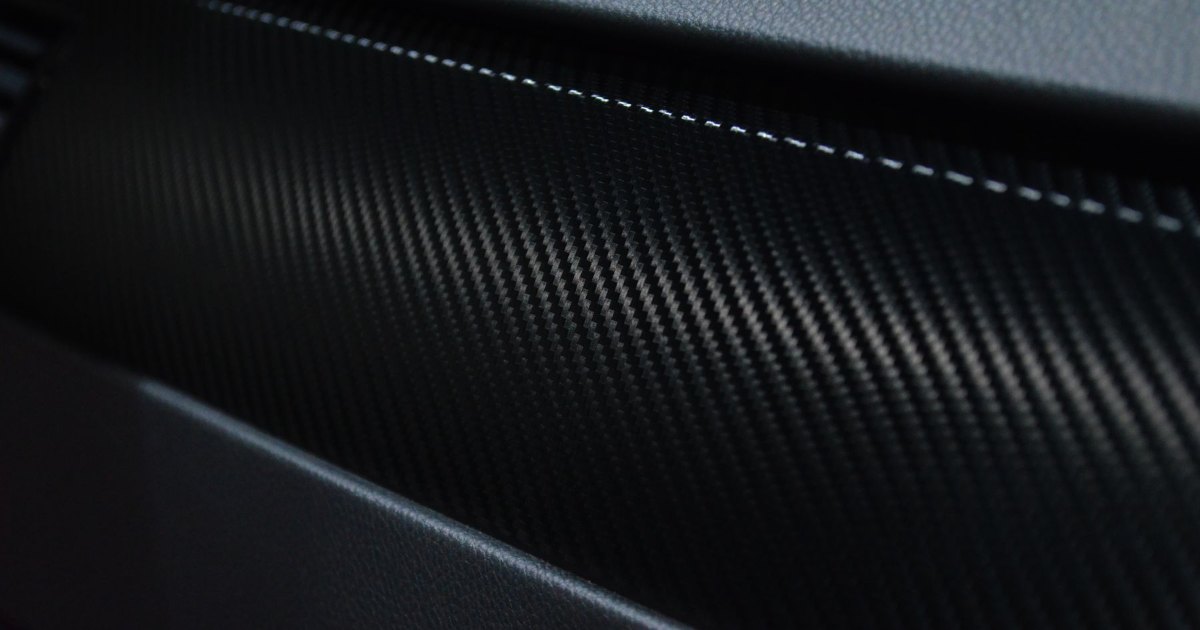 Carbon fibre weave close up Close view of a woven carbon fibre surface showing its cross hatch pattern