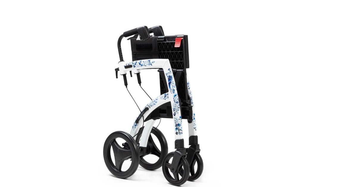 Folding wheelchair frame A folding wheelchair frame photographed against a white background