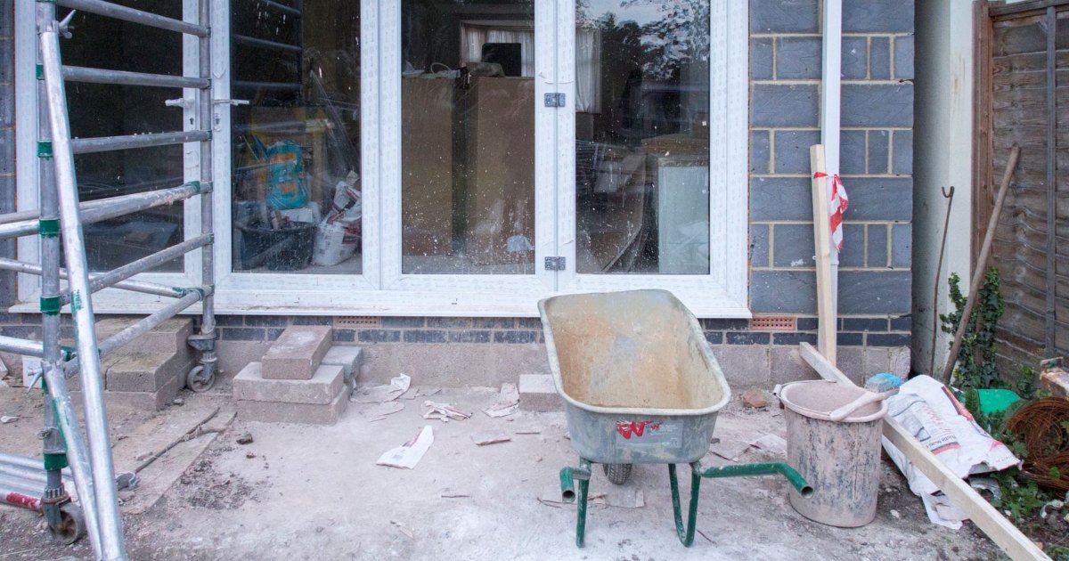 Scaffolding and building tools at a house undergoing renovation work