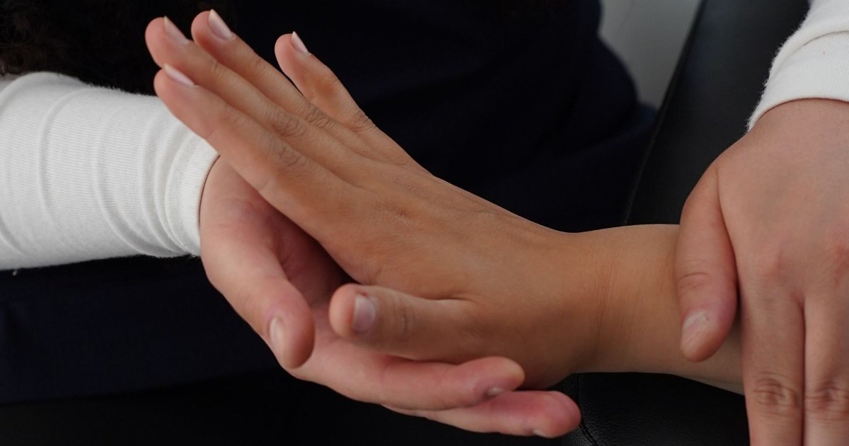 A close view of an arm being gently stretched