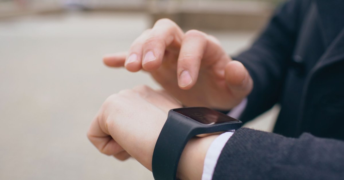 Checking a smartwatch A close view of a person checking a smartwatch
