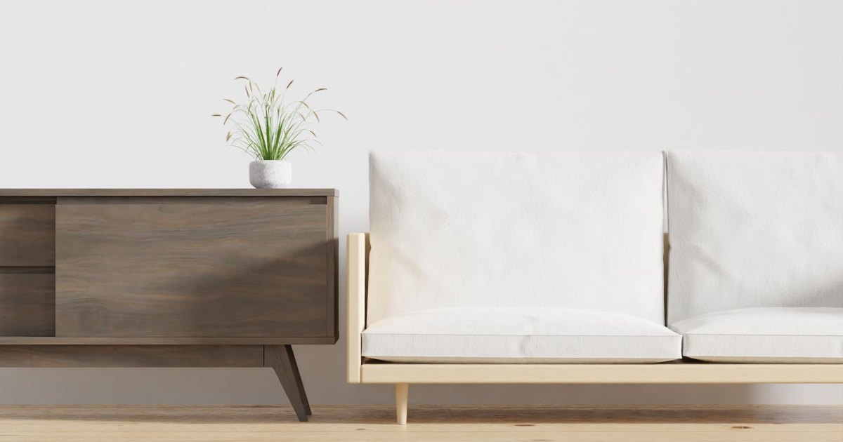 Neutral sofa and side table A neutral toned sofa beside a small side table