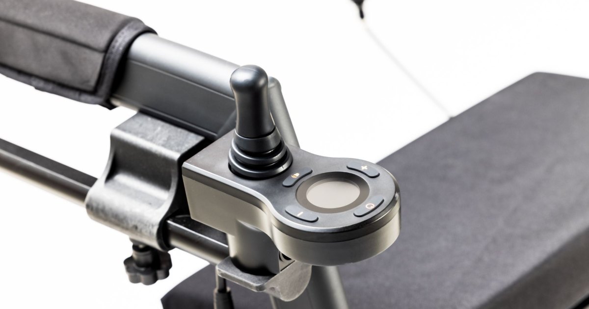 A close view of the brake lever on a wheelchair frame