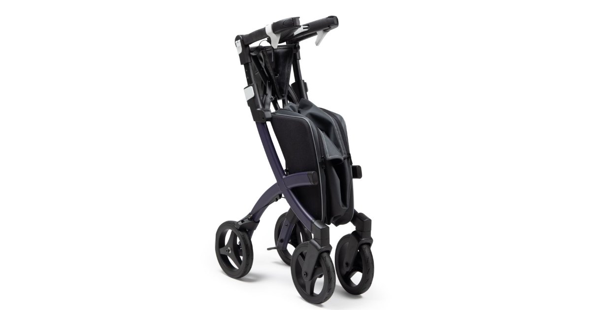 Foldable wheelchair with four wheels and a compact frame, shown in a standing position.