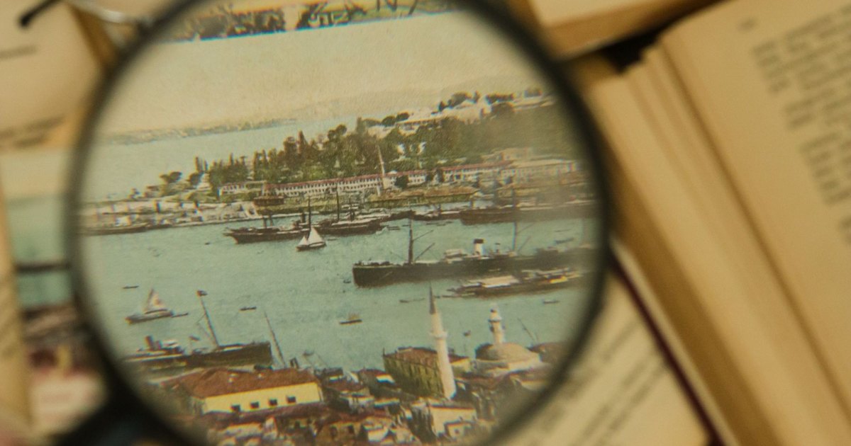 A magnifying glass held over a printed map