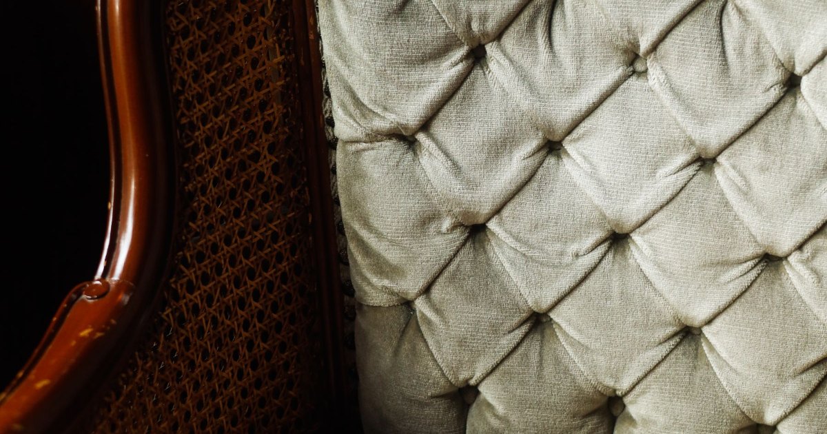 Buttoned chair back A close view of the buttoned back of an upholstered chair