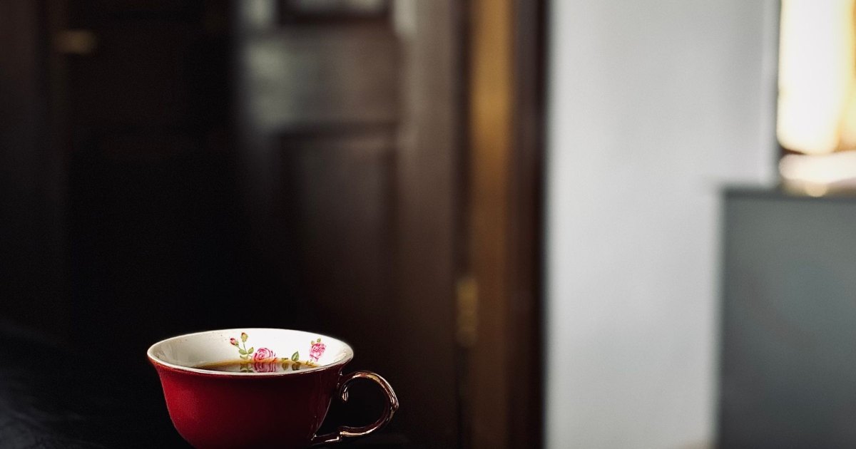 A cup of coffee resting on a table