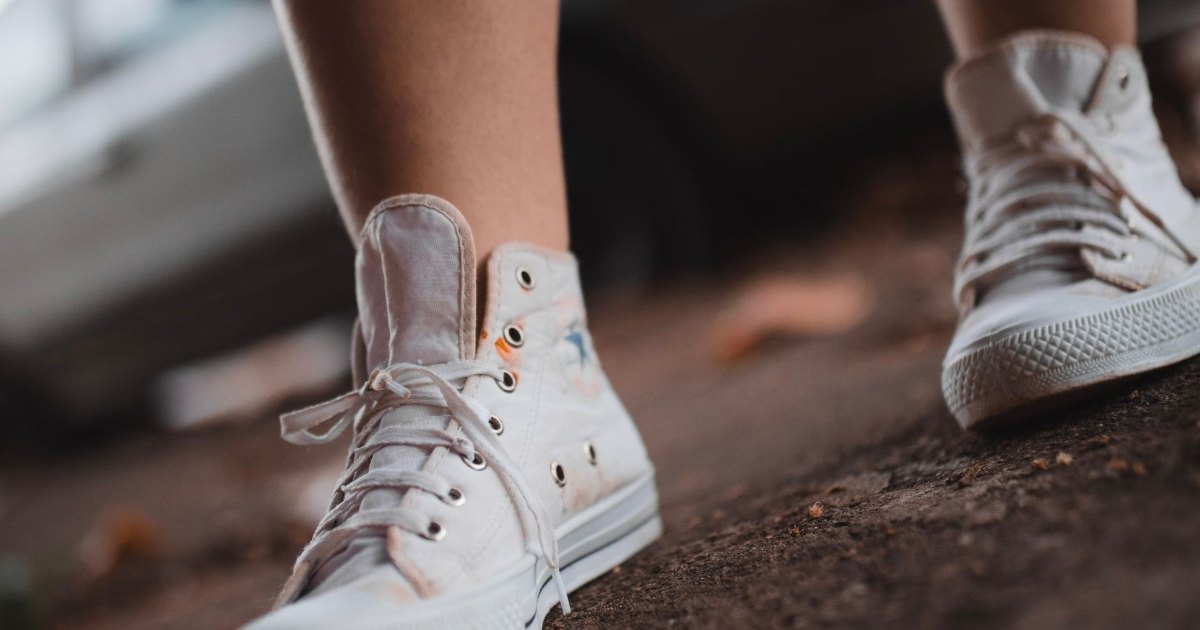 A close view of trainers walking along a pavement