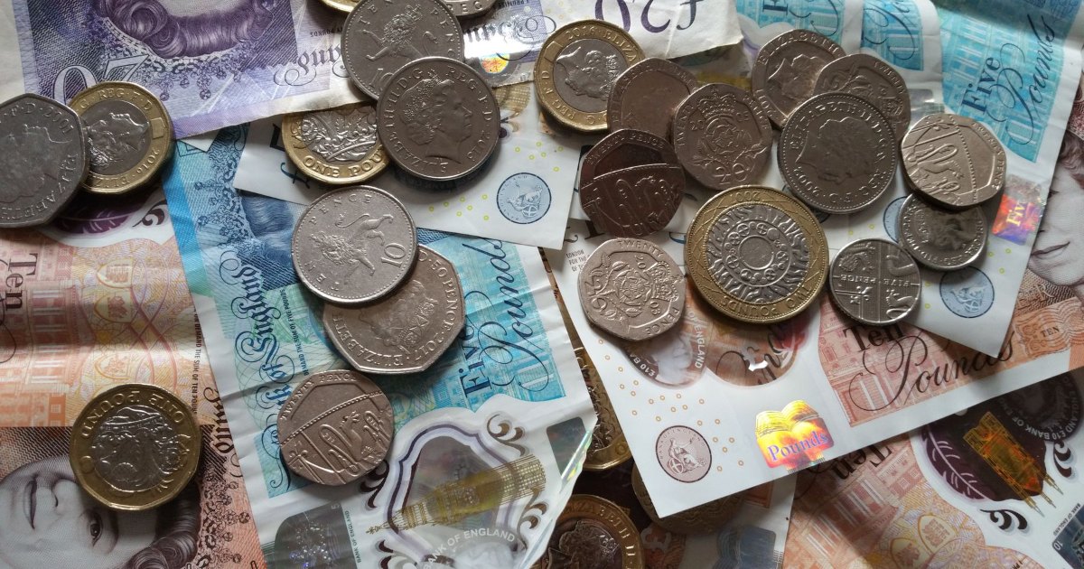 A close view of British pound and penny coins
