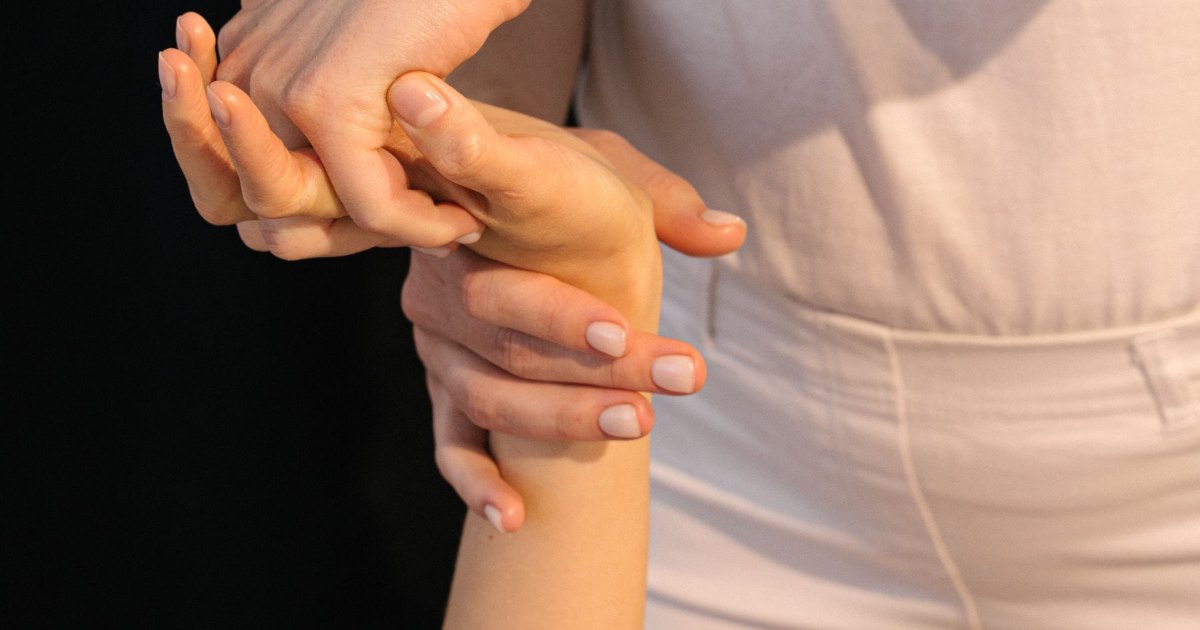 Physiotherapy on an arm A close view of an arm being treated by hand