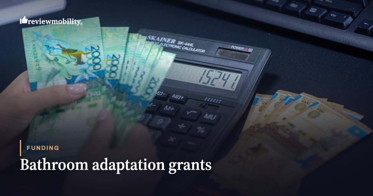 Hands count money with a calculator, illustrating funding for bathroom adaptation grants.