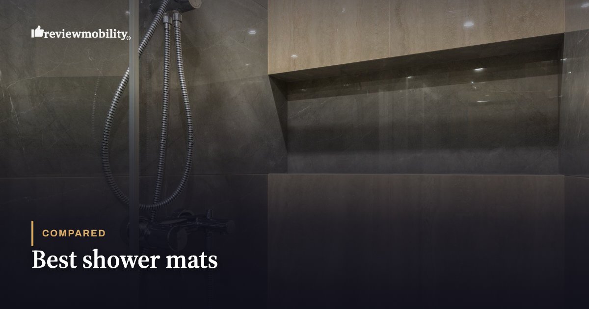 Best shower mats Hero image for a review article: dark tiled shower with a chrome handheld shower and brand logo in the top left; overlay text reads 'Compared Best shower mats'