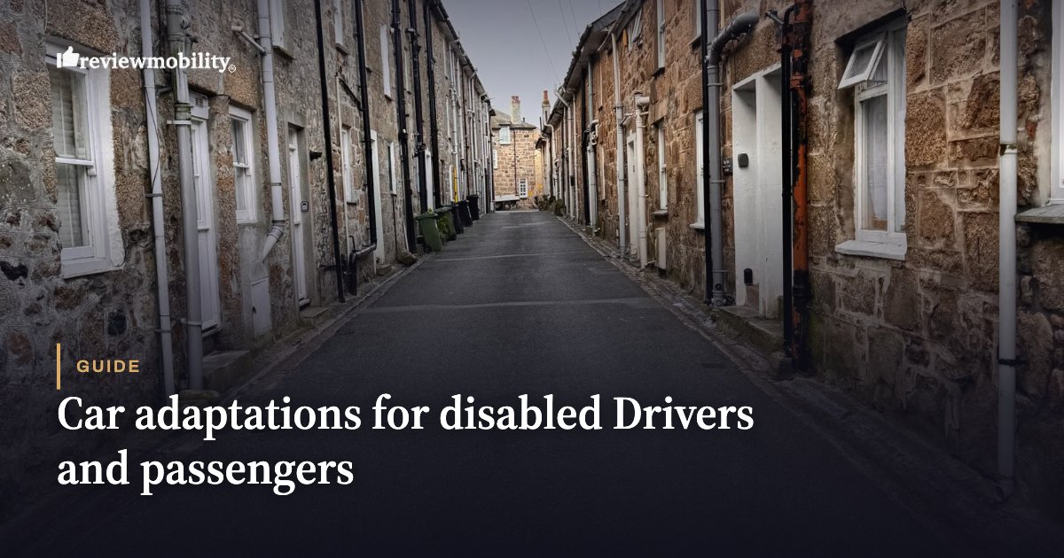 Guide-style hero image: narrow stone street with row houses and foreground title about car adaptations for disabled drivers and passengers.