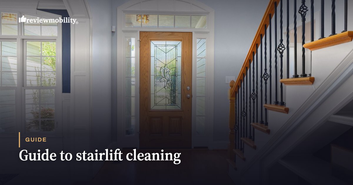 Guide to stairlift cleaning Entryway with a wooden front door and staircase, overlaid with the article title 'Guide to stairlift cleaning'.