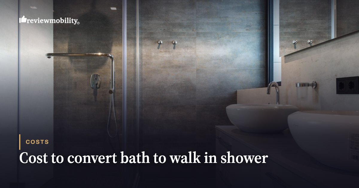 Cost to convert bath to walk in shower Modern bathroom with a glass shower enclosure, dark tiling, and two vessel sinks; article header reads 'Cost to convert bath to walk in shower'.