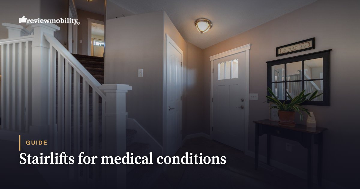 Entry hall with a white staircase on the left and a front door in the center, a console table and plant on the right.