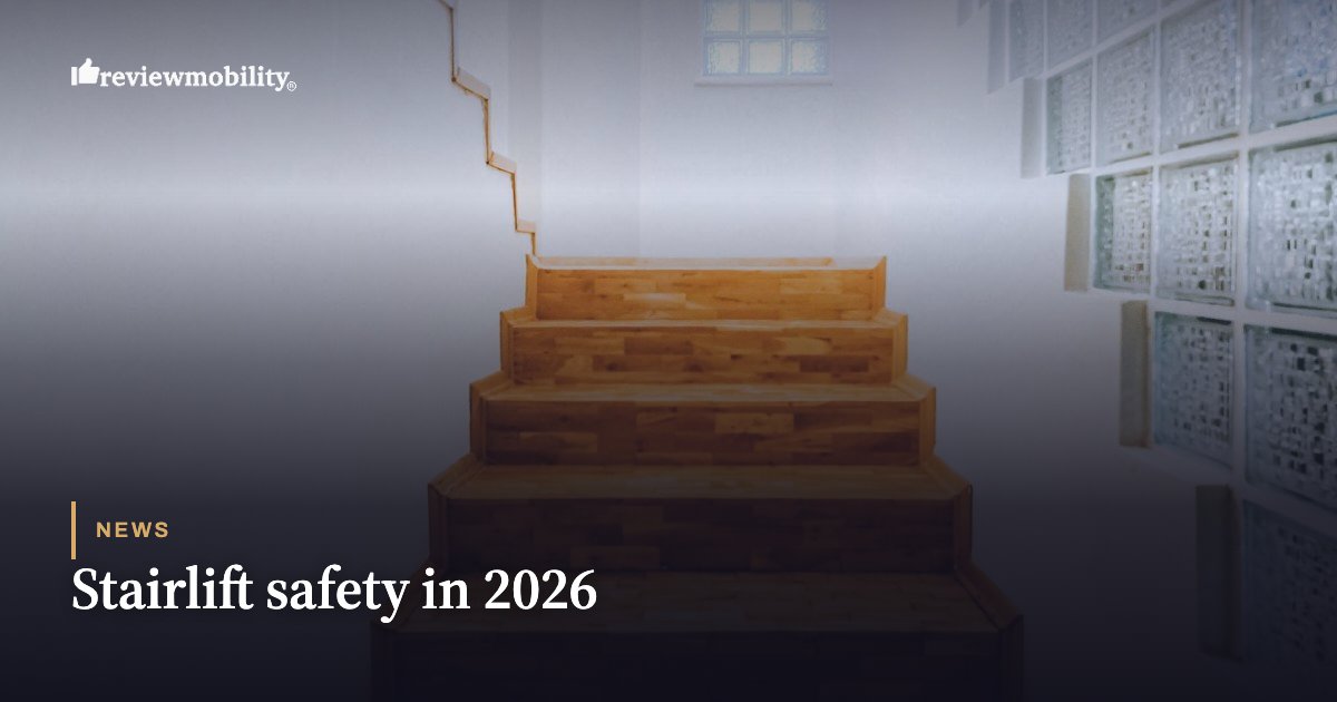 Wooden staircase leading upward, used as the hero image for a News article titled 'Stairlift safety in 2026' (Review Mobility logo visible).