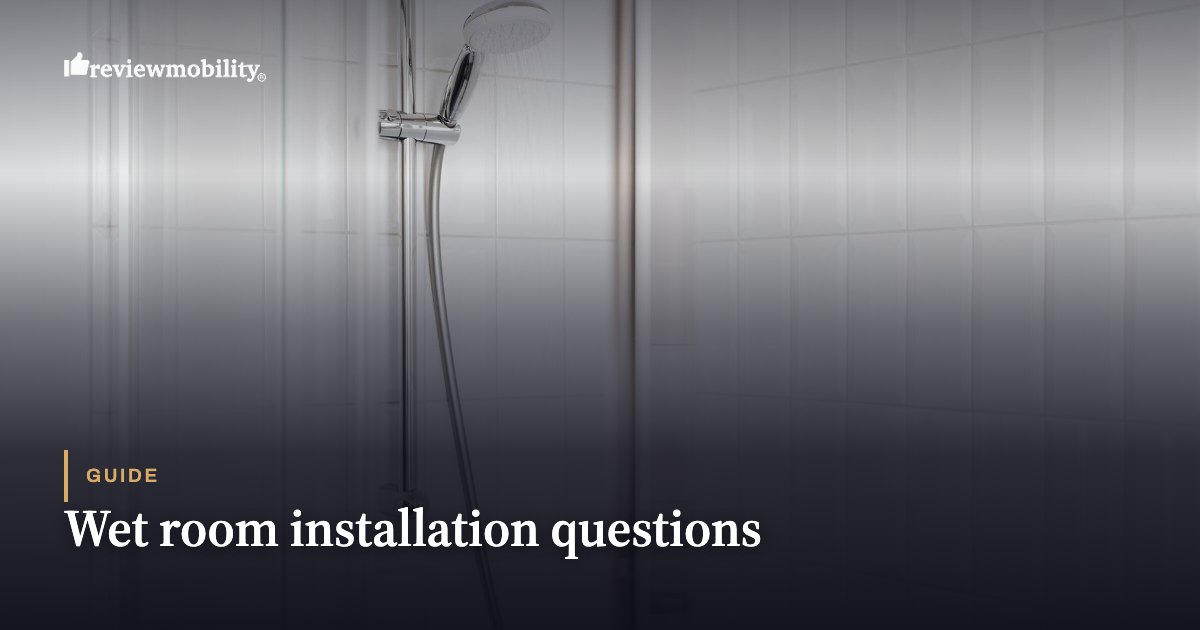 Hero image for a guide titled 'Wet room installation questions' showing a shower in a tiled wet room with a grey gradient overlay by Review Mobility.
