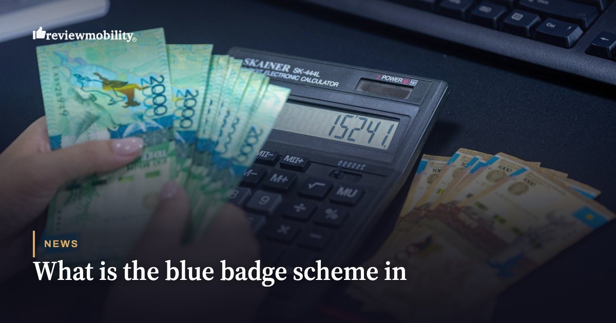 Person counting blue banknotes next to a calculator on a desk.